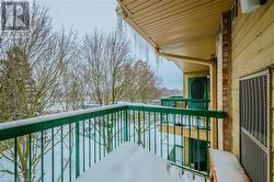 View of snow covered back of property - 