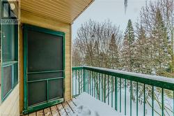 View of snow covered back of property - 