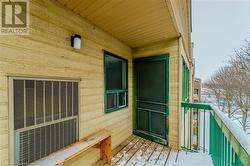 View of snow covered back of property - 