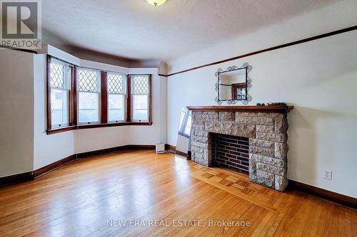 107 Haddon Avenue S, Hamilton, ON - Indoor Photo Showing Living Room With Fireplace