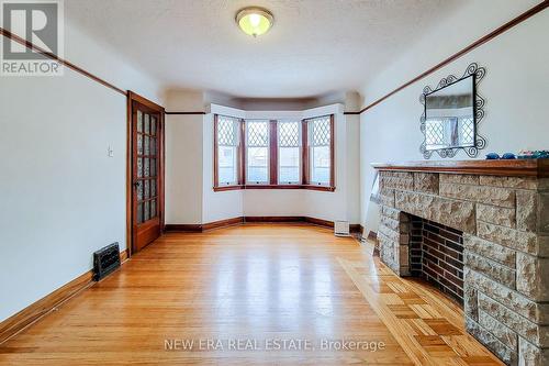 107 Haddon Avenue S, Hamilton, ON - Indoor With Fireplace