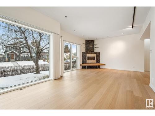 8771 Strathearn Dr Nw, Edmonton, AB - Indoor Photo Showing Living Room With Fireplace