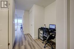 Office featuring light hardwood / wood-style flooring and expansive windows - 