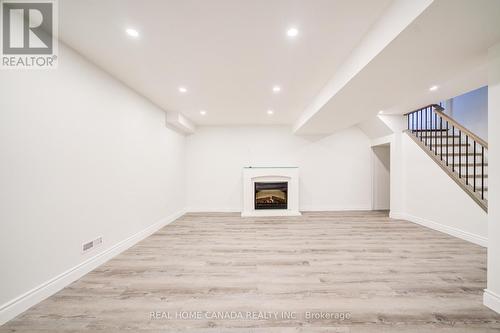 4222 Prudham Ave, Burlington, ON - Indoor Photo Showing Other Room With Fireplace