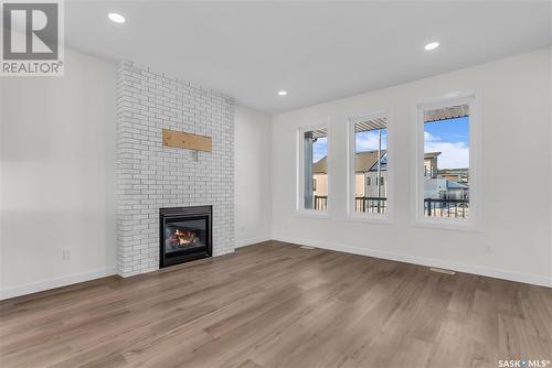 1023 Glacial Shores Common, Saskatoon, SK - Indoor Photo Showing Living Room With Fireplace