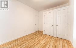 Unfurnished bedroom featuring light hardwood / wood-style floors - 