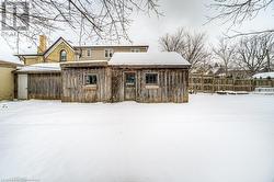 View of snow covered rear of property - 