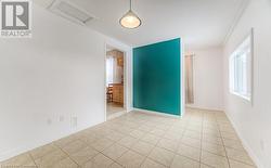 Unfurnished room featuring light tile patterned flooring - 