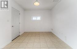 View of tiled spare room - 