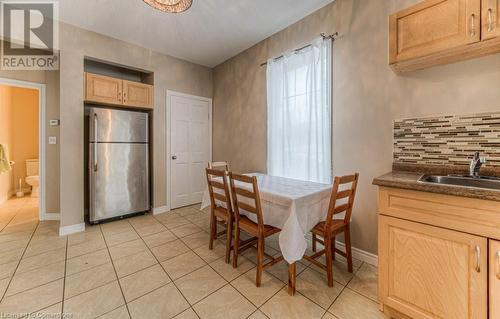 Tiled dining room featuring sink - 67 Wellington Street N, Kitchener, ON - Indoor