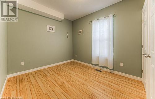 Empty room with light hardwood / wood-style flooring - 67 Wellington Street N, Kitchener, ON - Indoor Photo Showing Other Room