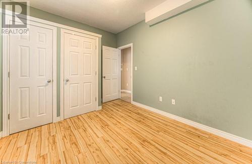 Unfurnished bedroom with light wood-type flooring - 67 Wellington Street N, Kitchener, ON - Indoor Photo Showing Other Room