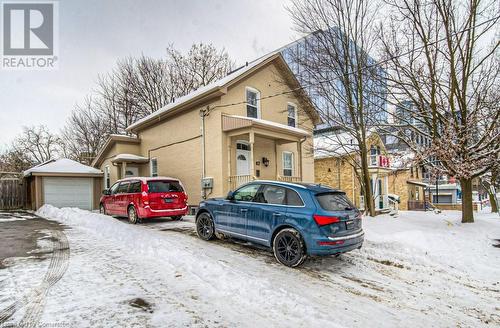 View of front facade featuring a garage and an outbuilding - 67 Wellington Street N, Kitchener, ON - Outdoor