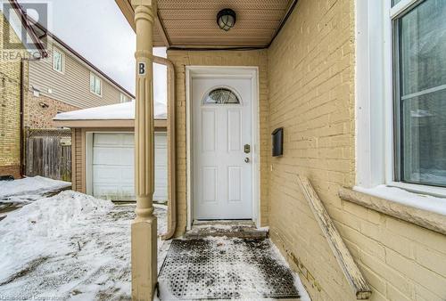 Property entrance with a garage - 67 Wellington Street N, Kitchener, ON - Outdoor With Exterior