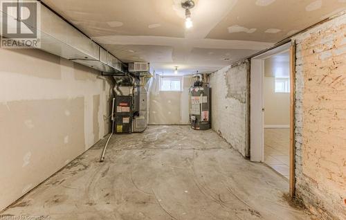 Basement featuring heating unit and gas water heater - 67 Wellington Street N, Kitchener, ON - Indoor