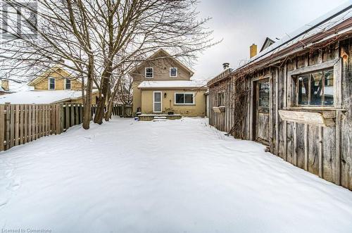 View of yard covered in snow - 67 Wellington Street N, Kitchener, ON - Outdoor