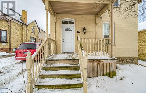 View of snow covered property entrance - 67 Wellington Street N, Kitchener, ON - Outdoor