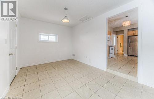 Spare room with light tile patterned flooring - 67 Wellington Street N, Kitchener, ON - Indoor Photo Showing Other Room