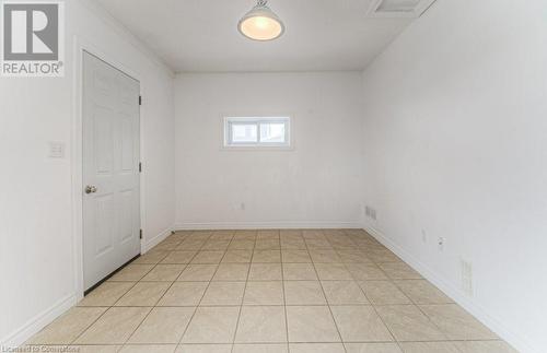 View of tiled empty room - 67 Wellington Street N, Kitchener, ON - Indoor Photo Showing Other Room