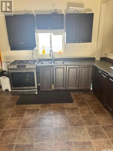 1447 Rae Street, Regina, SK - Indoor Photo Showing Kitchen With Double Sink