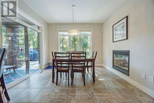 1519 Privet Place, London, ON - Indoor Photo Showing Dining Room With Fireplace