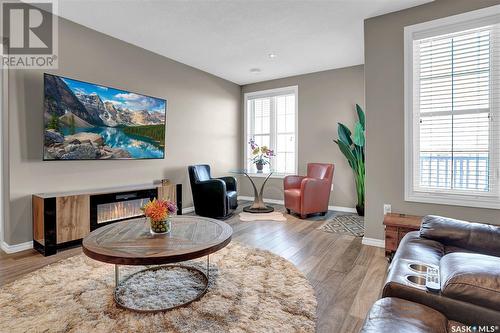 303 1715 Badham Boulevard, Regina, SK - Indoor Photo Showing Living Room With Fireplace