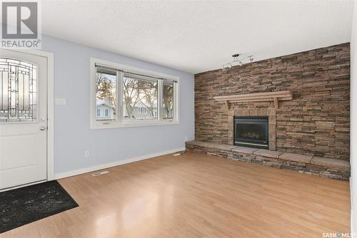 18 Sibbald Crescent, Regina, SK - Indoor Photo Showing Living Room With Fireplace