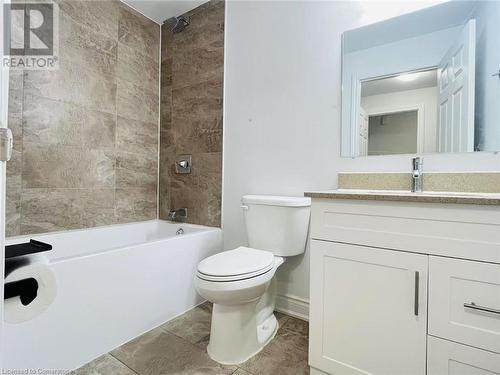 Full bathroom with tile patterned floors, vanity, toilet, and tiled shower / bath combo - 255 Woolwich Street Unit# 203, Waterloo, ON - Indoor Photo Showing Bathroom