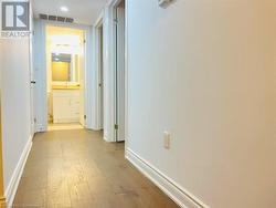 Hall with light wood-type flooring - 