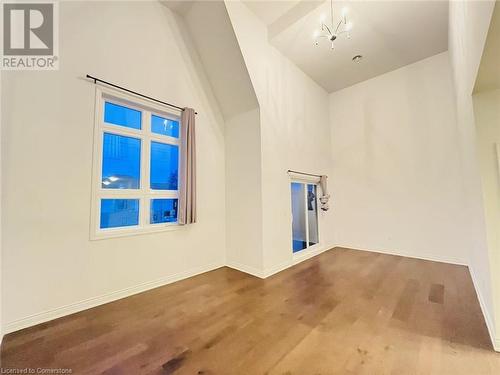 Bonus room featuring a notable chandelier - 255 Woolwich Street Unit# 203, Waterloo, ON - Indoor Photo Showing Other Room