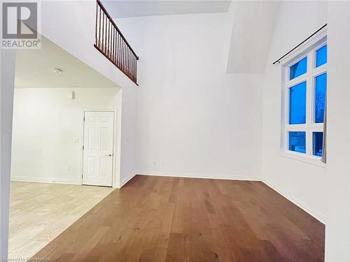 Unfurnished room featuring vaulted ceiling and light wood-type flooring - 255 Woolwich Street Unit# 203, Waterloo, ON - Indoor Photo Showing Other Room