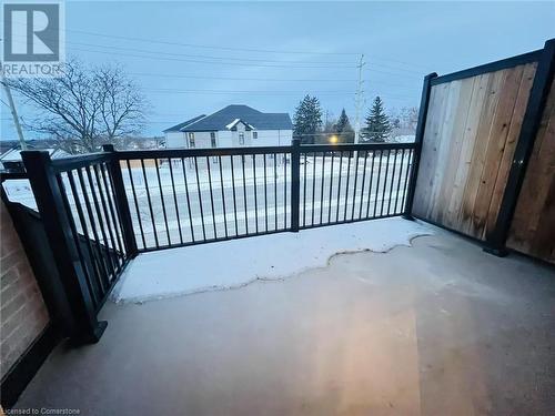 View of snow covered gate - 255 Woolwich Street Unit# 203, Waterloo, ON - Outdoor With Balcony