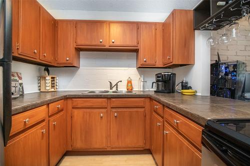 228-1665 Ufton Court, Kelowna, BC - Indoor Photo Showing Kitchen With Double Sink