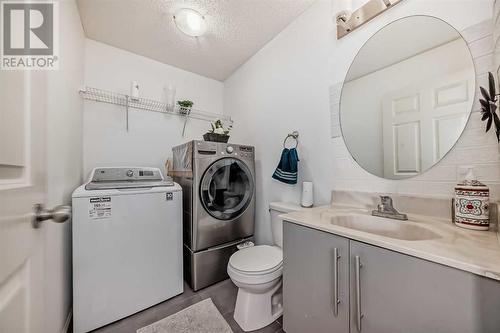 504 Saddlecrest Boulevard Ne, Calgary, AB - Indoor Photo Showing Laundry Room