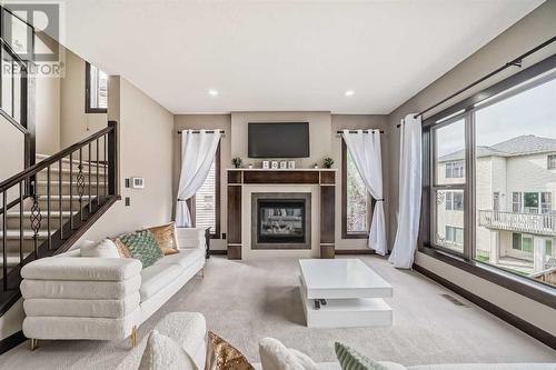 181 Everoak Circle Sw, Calgary, AB - Indoor Photo Showing Living Room With Fireplace