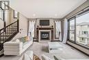 181 Everoak Circle Sw, Calgary, AB  - Indoor Photo Showing Living Room With Fireplace 