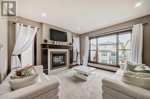 181 Everoak Circle Sw, Calgary, AB - Indoor Photo Showing Living Room With Fireplace