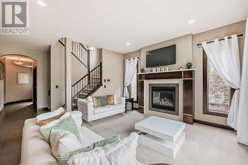 181 Everoak Circle Sw, Calgary, AB - Indoor Photo Showing Living Room With Fireplace