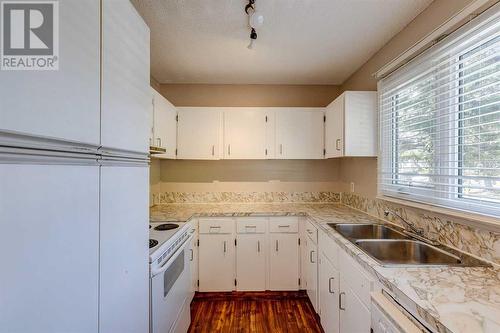 703, 120 Silvercreek Close Nw, Calgary, AB - Indoor Photo Showing Kitchen With Double Sink