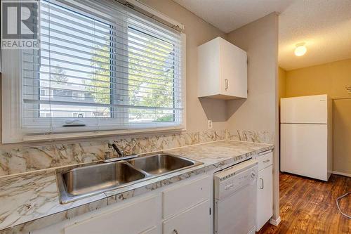 703, 120 Silvercreek Close Nw, Calgary, AB - Indoor Photo Showing Kitchen With Double Sink