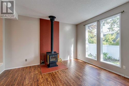 703, 120 Silvercreek Close Nw, Calgary, AB - Indoor With Fireplace