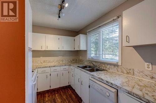 703, 120 Silvercreek Close Nw, Calgary, AB - Indoor Photo Showing Kitchen With Double Sink