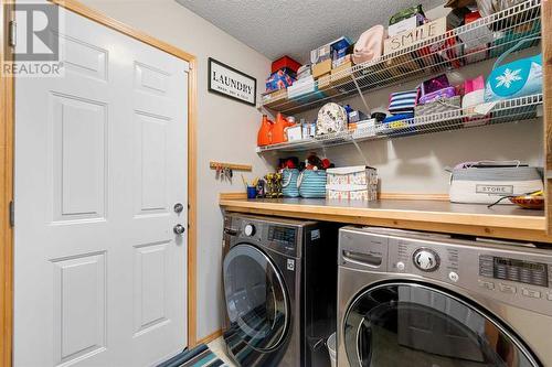 209 Tuscany Ravine Road Nw, Calgary, AB - Indoor Photo Showing Laundry Room