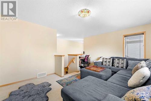 209 Tuscany Ravine Road Nw, Calgary, AB - Indoor Photo Showing Living Room