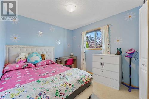 209 Tuscany Ravine Road Nw, Calgary, AB - Indoor Photo Showing Bedroom