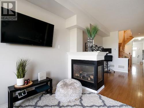 100 Gosnel Circle, Bradford West Gwillimbury, ON - Indoor Photo Showing Living Room With Fireplace