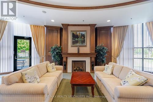 35 - 3 Tuscany Lane, Brampton (Sandringham-Wellington), ON - Indoor Photo Showing Living Room With Fireplace