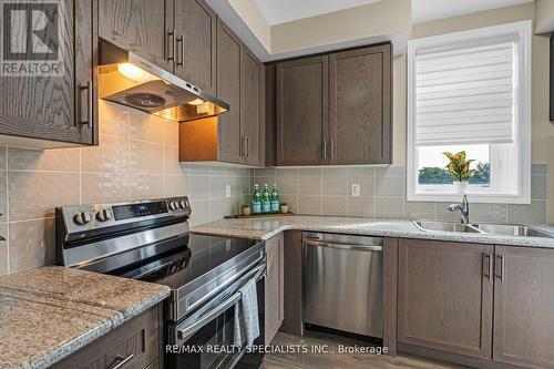 406 - 70 Halliford Place, Brampton, ON - Indoor Photo Showing Kitchen With Double Sink