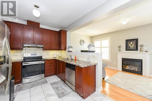 53 Everingham Circle, Brampton (Sandringham-Wellington), ON - Indoor Photo Showing Kitchen With Fireplace With Double Sink