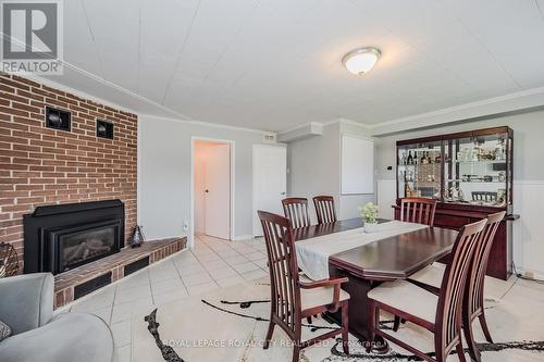 17 Ryan Avenue, Guelph, ON - Indoor Photo Showing Dining Room With Fireplace